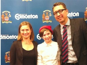 Julie Kusiek, left, and Nessa Deans talk about their community political activities with Coun. Michael Walters at a press conference for the  Everyday Political Citizen project in Edmonton on Oct. 9, 2014.