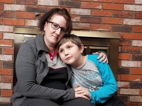 Karolyn Slowsky is pictured with her son Mackenzie, 9, in the day home that Mackenzie goes to before and after school. It is extremely difficult for families to get day care in Alberta, based on an exclusive study that looks at wait lists and challenges for families with infants and disabled kids.