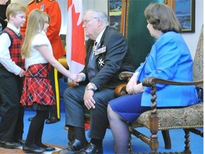 Keira Wharton, 7, and her brother Aiden,9, greet Lt.-Gov. Donald Ethell at last year's levee at Government House.