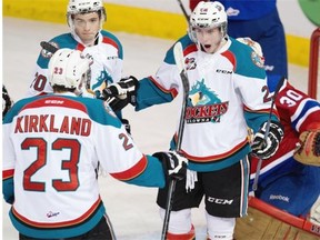 Kelowna Rockets Cole Linaker celebrates his first period goal on Edmonton Oil Kings goalie Tristan Jarry with teammates during WHL action on Dec. 16, 2014, in Edmonton.