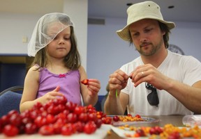 Kevin Kossowan, seen here with his daughter Evelyne, has just released a new video about the Slow Food movement in Canada.