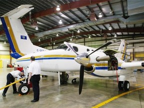 A King Air 200 owned by the Alberta government sits in the hangar for maintenance work in 2004.