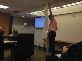 Resident Gord Lacey attempts to illustrate 2.45 metres for the SDAB.