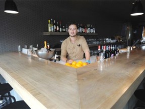 Landon Schedler (pictured) designed and installed this bar top at Bar Bricco on Jasper Avenue. The carpenter now returns as a customer.