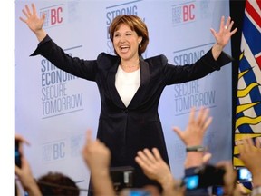 BC Liberal leader Christy Clark waves to the crowd after she arrives on stage after winning the British Columbia provincial election in Vancouver on May 14, 2013.
