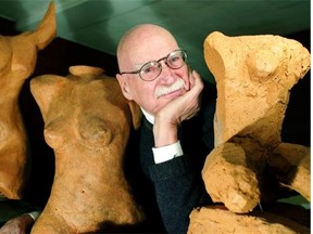 Louis Munan displays his clay sculptures in an exhibition he shared with his son, Marc, in 2003.