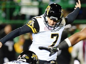 Luca Congi of the Hamilton Tiger-Cats kicks a field goal during the Grey Cup game against the Saskatchewan Roughriders at Mosaic Stadium in Regina on Nov. 24, 2013.