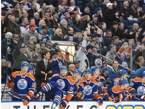Luke Gazdic (20)of the Edmonton Oilers, hops the boards to celebrate a 2-1 victory over the San Jose Sharks at Rexall Place in Edmonton. Edmonton snapped an 11 game winless streak with the win.