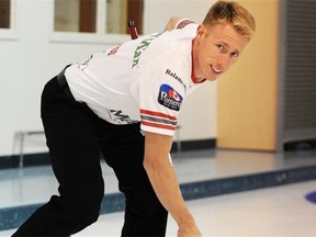 Marc Kennedy shows curlers how to get more weight on the broom to do more effective sweeping.