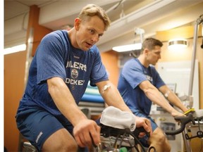 Matt Hendricks of the Edmonton Oilers uses a stationary bike during training camp at Rexall Place.