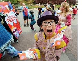 A member of The Prince of Teeth from Korea takes part in the Fringe Parade in Old Strathcona on Thursday.