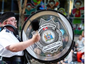One of the members of the Edmonton Transit Pipes and Drums Band plays a bass drum during the Capital Ex parade in 2010.