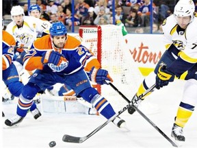 Nashville Predators forward Matt Cullen fights off Edmonton Oilers centre Boyd Gordon during first period NHL hockey action in Edmonton on Oct. 29, 2014.