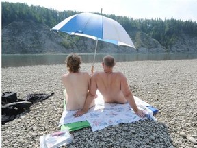 Naturists Jonathon and Sandy relax at CottonTail Corner, a nude beach near Devon that Jonathon rediscovered three years ago. He called it CottonTail Corner after the name given newbie nudists whose sun-deprived bottoms are as white as a cottontail rabbit’s behind.