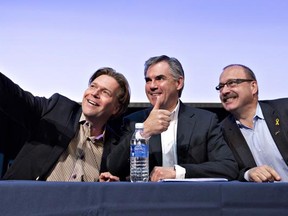 Progressive Conservative leadership candidates Thomas Lukaszuk, left, Jim Prentice and Ric McIver pose for a selfie before and taking part in a lunchtime forum in Edmonton, on Saturday May 24, 2014.