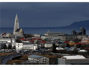 Buildings surround the Hallgrimskirkja tower in the Icelandic capital in Reykjavik, Iceland.