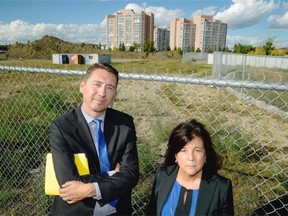 Edmonton City Councillor Michael Walters (left) and area resident Mattie Matheson (right) at the Century Park development in southwest Edmonton. The development was supposed to be Edmonton’s première transit-oriented development when it commenced almost eight years ago but work has halted at the site. Area residents are concerned with a massive dirt pile which blows into nearby residences.