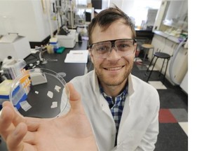 Dominic Sauvageau with smart material for pathogen detection that his team is developing in a lab at the U of A in Edmonton on Wednesday Aug. 20, 2014.