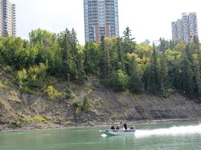 The Edmonton Police Service and Edmonton Fire Rescue are using their boats and the Police helicopter to search the North Saskatchewan River shoreline for potential human remains on Wednesday, Sept. 3, 2014. The goal is to close missing persons files with the RCMP and the EPS.