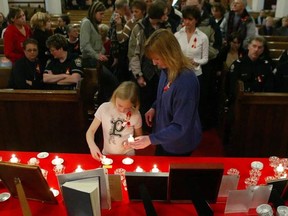 Edmontonians attend an annual Mothers Against Drunk Driving candlelight vigil of remembrance and hope, in memory of those killed by impaired drivers, at Holy Trinity Anglican Church in 2004.