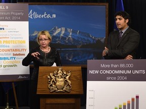 MLA Cathy Olesen and Service Alberta Minister Stephen Khan speak to media about the new Bill 9 on condominiums at the Alberta Legislature in Edmonton on Dec. 2, 2014.