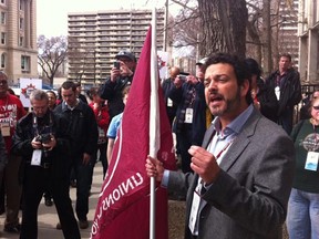 Alberta Federation of Labour president Gil McGowan addresses fellow members at a rally outside the Labour Relations Board hearing on 99th Avenue and 108th Street on April 27, 2013, in solidarity to striking detention centre guards.