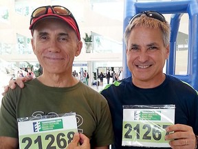 Dr. Ramon Rivera, left, and friend Benjamin Brown pose prior to competing at the recent Triathlon World Chmapionships in Edmonton. Dr. Rivera suffered a heart attack during a swimming event on Aug. 29 and died at the University of Alberta Hospital on Sept. 1.