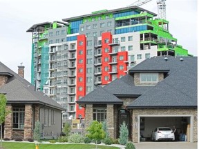 This is one of two residential towers that run along Windermere Blvd. with homes in front in Edmonton on August 29, 2013.