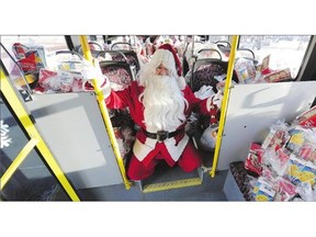 Santa Claus was on hand at Edmonton Transit's Stuff a Bus event at City Hall on Wednesday. Donations from the campaign benefit Edmonton's Food Bank.