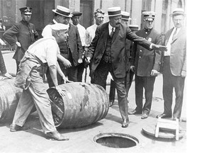 Kegs of beer are disposed of during Prohibition in the United States. Scenes like this took place anywhere drinking was prohibited, such as in Edmonton in 1917.