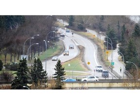 Traffic moves along River Road and Groat Road. Warm spring weather just days ago took a nasty turn in Edmonton on Monday, April 29, 2013.