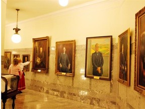 The official portraits hang outside the premier’s office at the Alberta legislature. The province has just confirmed plans to add a portrait of Alison Redford to the collection.