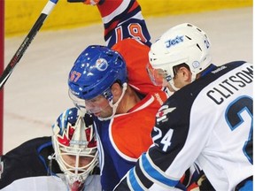 Oilers forward Benoit Pouliot appears to score on Jets goalie Michael Hutchinson on Sept. 29, 2014, but it was disallowed.