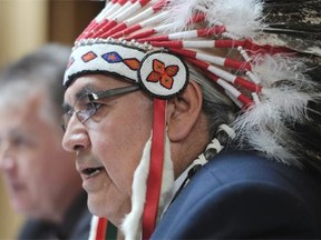 Onion Lake First Nation Chief Wallace Fox speaks to media with legal counsel Robert Hladun during a press conference at the Ramada Inn in Edmonton on Wednesday Nov 26, 2014.