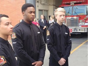 Matthew Durda, 17, Shemar Sinclair, 18, and Carter Duzsik, 15, are three of 20 teenagers who were selected to join the fire service’s new Fire Cadet program. They inspect a fire truck at an announcement for the fire service’s new fire cadet program.