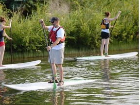 Paddleboarders find their balance at Rundle Park.