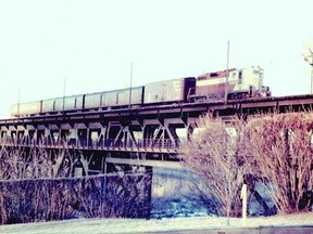 A CPR passenger train crosses the High Level Bridge, circa 1958.