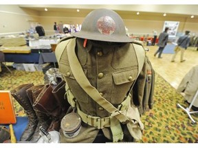 People browse around the Military Collectors Club of Canada Annual Show at the Ramada Hotel featuring more than 100 trade and display tables. The military collectors club of Canada was formed in 1963 as a fraternity to the collectors of military artifacts. It has become a focal point for the Canadian collectors of all types of military related artifacts ranging from medals, badges, artwork, to weaponry, vehicles and just about anything military related you could imagine. in Edmonton on Friday Sept. 12, 2014.