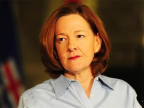 Premier Alison Redford announces her resignation in the main rotunda of the Alberta legislature in Edmonton, March 19, 2014.