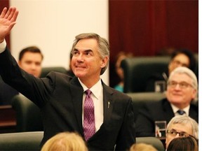 Premier Jim Prentice waves to someone in the gallery after the throne speech in the Alberta Legislature on Nov. 17, 2014.