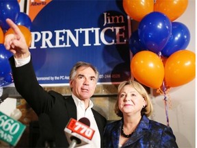 Jim Prentice and his wife Karen after winning the post by-election speaks at his headquarters at Moo’s in Calgary on October 27, 2014.