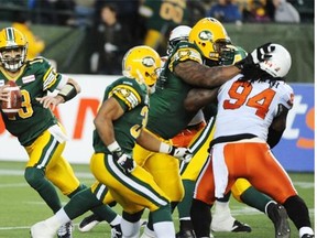 Quarterback Mike Reilly (13) of the Edmonton Eskimos, against  the B.C. Lions at Commonwealth Stadium in Edmonton.