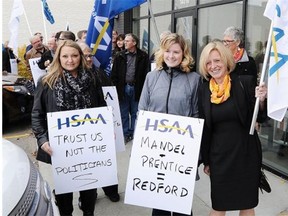 NDP MLA Rachel Notley joined in as Health-care workers rally outside Health Minister Stephen Mandel’s campaign office over the noon hour in Edmonton on Wednesday Oct. 15, 2014. The Health Services Association of Alberta criticizes political paralysis for causing a breakdown in contract negotiations for 17,000 health workers.