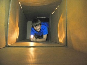 Regan Nickel, 10, makes his way through the cardboard Halloween maze in the City Room at City Hall, open to kids age 5 to 12 for the week prior to Halloween.