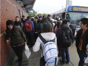 Riders catch buses from the Millwoods Transit Centre.