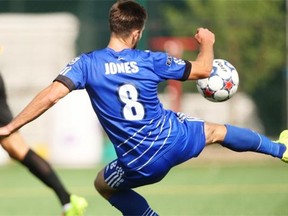Ritchie Jones leaves his feet to send the ball toward the net as the FC Edmonton take on the Fort Lauderdale Strikers at Clarke Stadium on Aug. 24, 2014. Edmonton won the game 2-1.