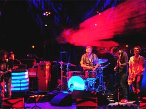 Ryan Adams, left, and his band perform in concert at the Winspear Centre on Thursday.