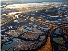 Suncor’s Millennium oilsands mine near Fort McMurray, as seen in June 2013: Dennis Doll writes that those wishing to address climate change should offer constructive leadership.