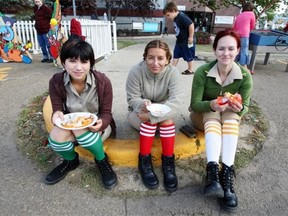 Safari guides, left to right, Victoria Felicitas, Annie Dugan and Kristi Hansen kept their socks pulled up as they had a lunch break during the Kaleido Festival on Alberta Avenue in Edmonton in September 2009. Knee-high socks have a long history, dating back to the Roman Empire.