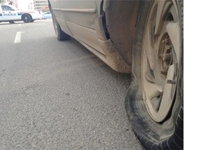 A car at the scene of a hit-and-run accident in downtown Edmonton on Wednesday, Sept. 24, 2014.